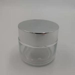 Quality MSDS Clear 100g Glass Cream Jar With Shiny Silver Cap White Lid Mask Mud wholesale