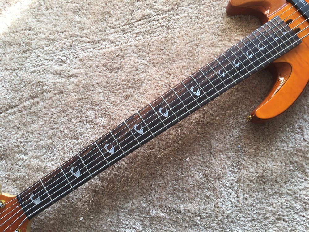 6 string bass guitar JP2 yellow quilted maple body back and front Active pickups Golden bridges and tuner Alder with ebo