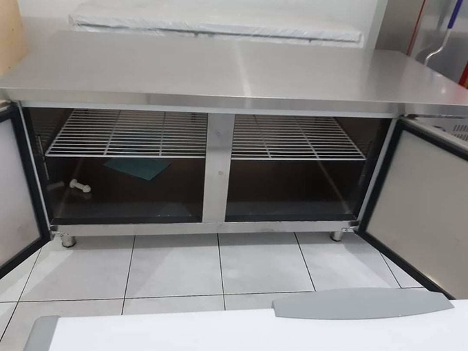 Stainless steel commercial refrigerator workbench in the back kitchen of hotel restaurant 8