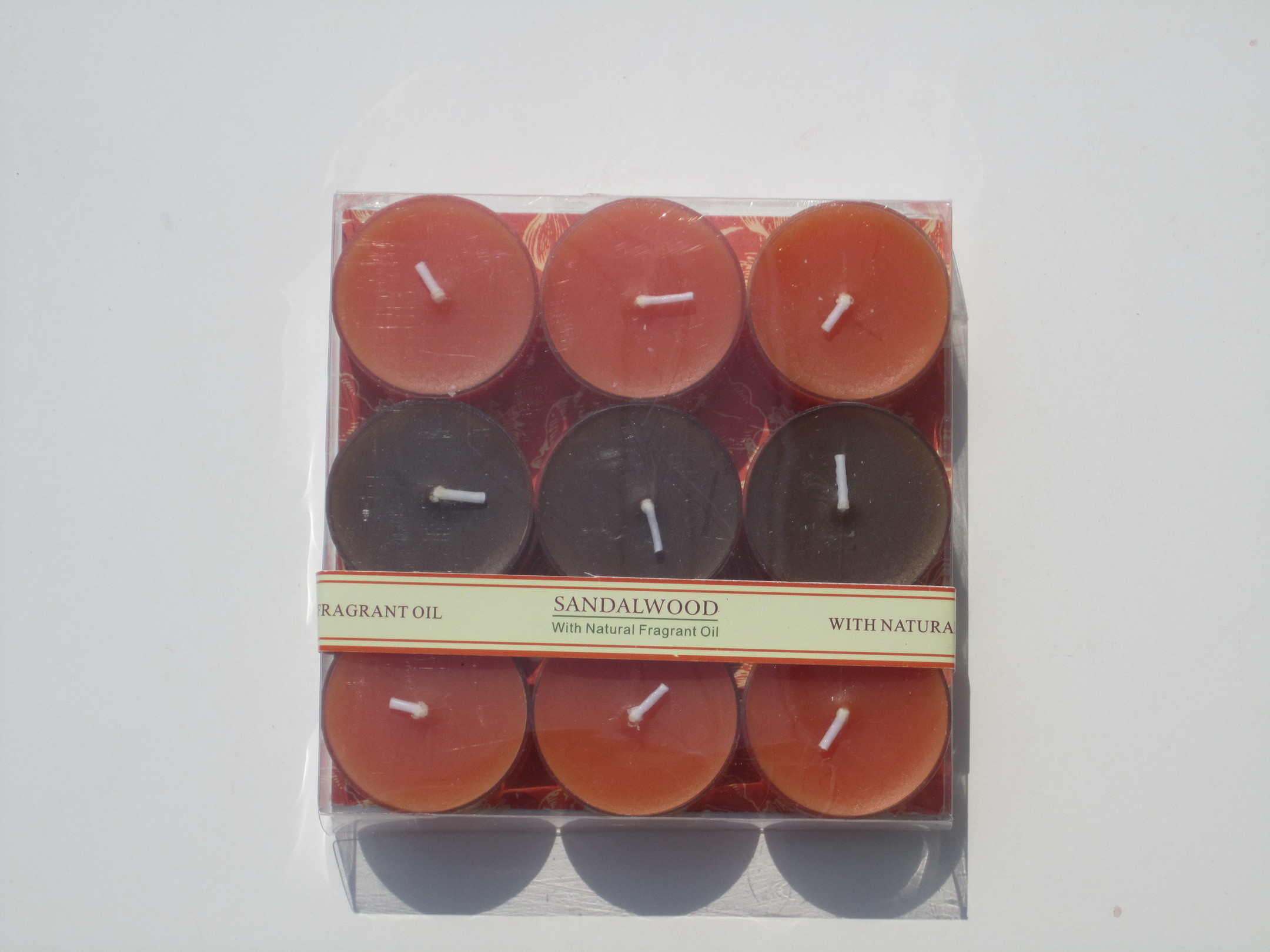 9pk Orange & Brown scented assorted tealight candle with printed label and packed into clear box
