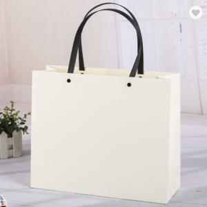 Quality Pantone Colored Kraft Paper Bag Packaging With Synthetic Handles wholesale