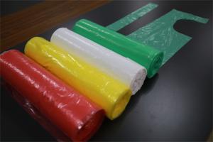 Quality Household Colored Disposable PE Apron On Rolls Round Neck Fluid Prevention wholesale