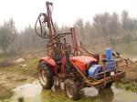 Tractor drilling rig farmland oil exploration
