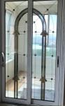 Decorative leaded glass with brass came in sliding doors