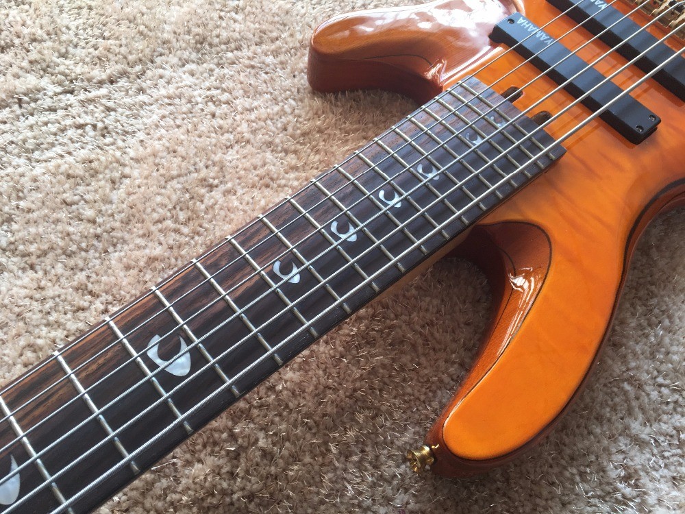 6 string bass guitar JP2 yellow quilted maple body back and front Active pickups Golden bridges and tuner Alder with ebo