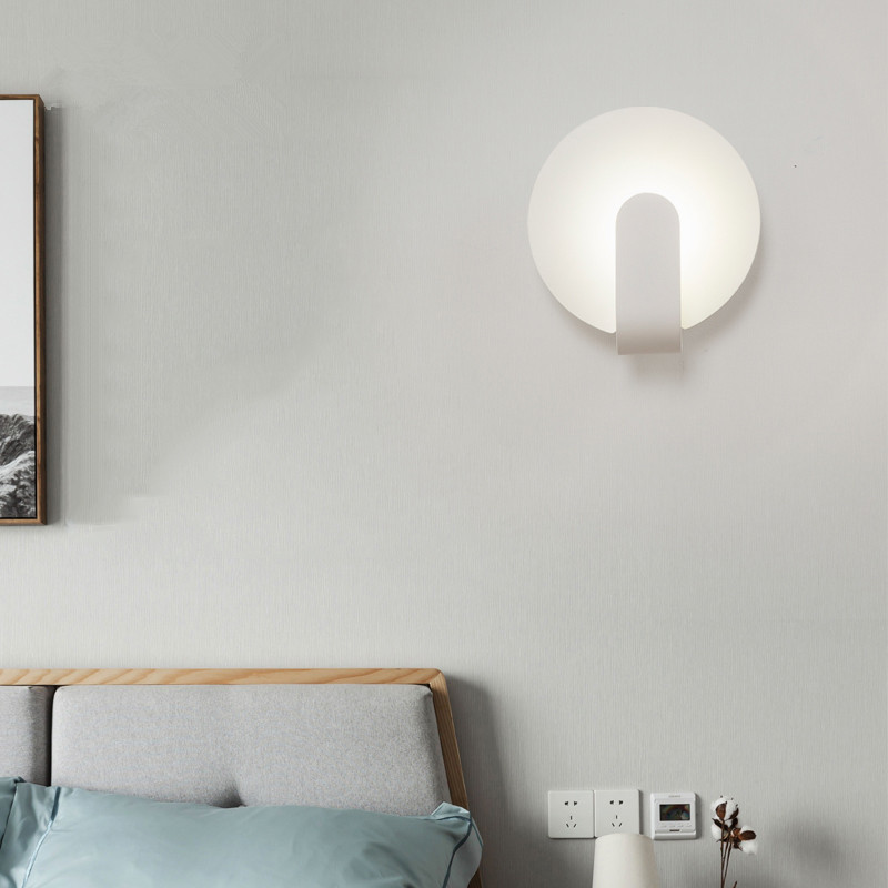 Modern simple and creative bedroom bedroom iron art wall lamp.