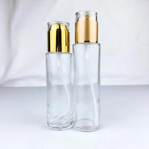 Quality round empty glass cosmetic liquid foundation serum lotion bottle with pump wholesale