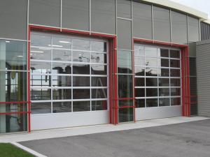 China Glass / Polycarbonate Aluminum Sectional Door Heat Resistance Smoothly With Motor on sale