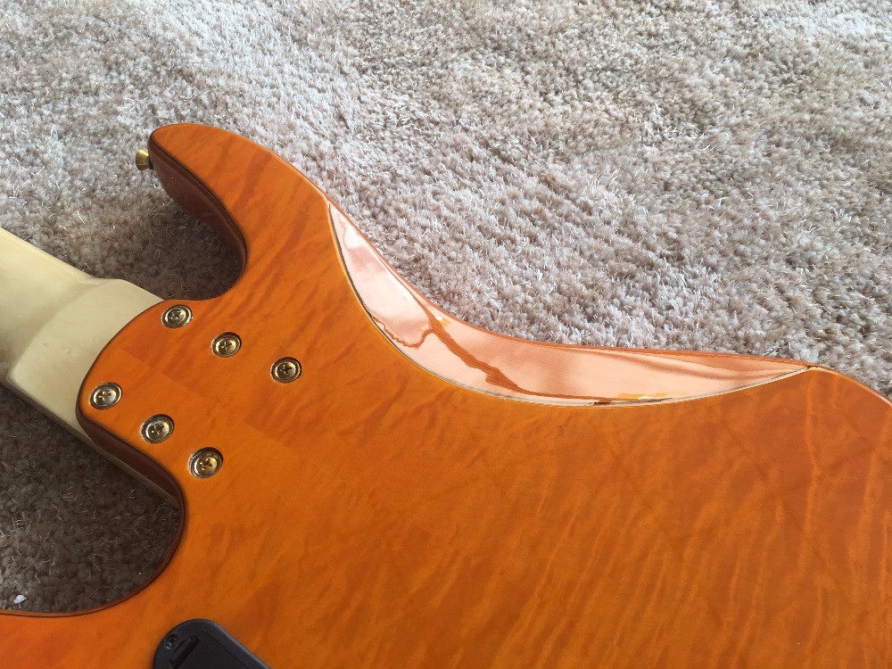 6 string bass guitar JP2 yellow quilted maple body back and front Active pickups Golden bridges and tuner Alder with ebo