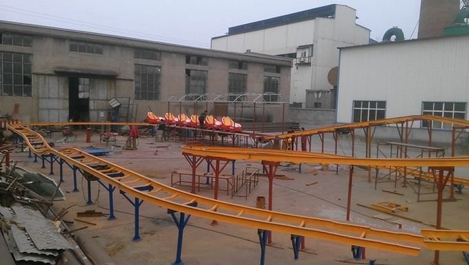 Space Train Design Kiddie Roller Coaster Customized Capacity For Children / Adults