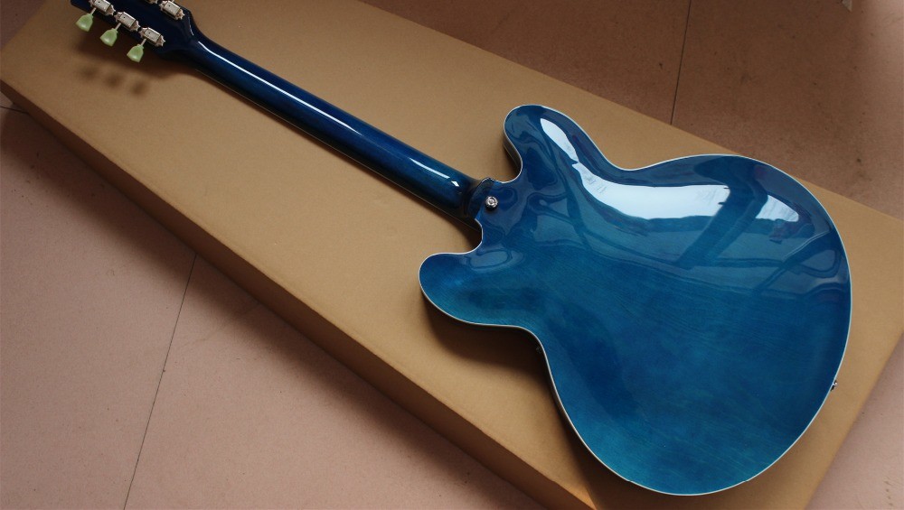 High quality electric guitar in blue color hollow body with chrome hardware