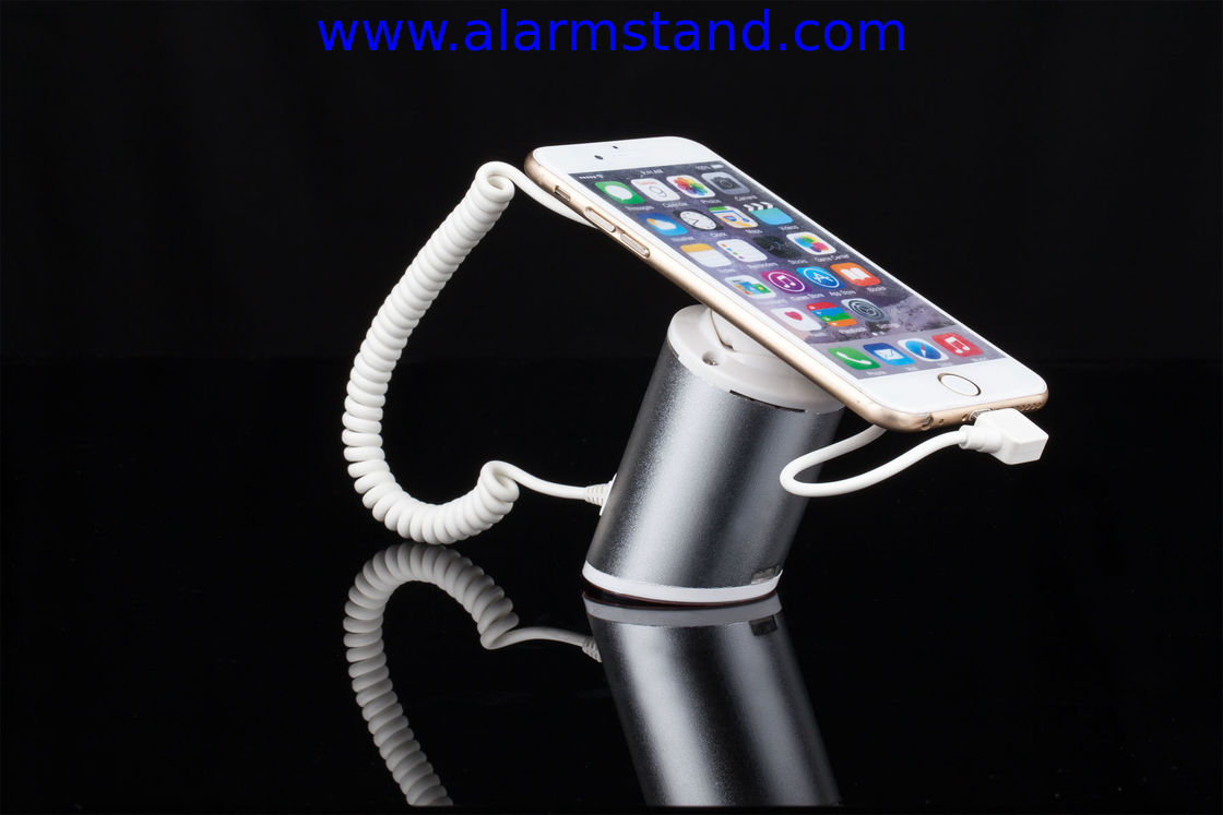 COMER High quality Rotating display stand for phone with charging cable and alarm sensor