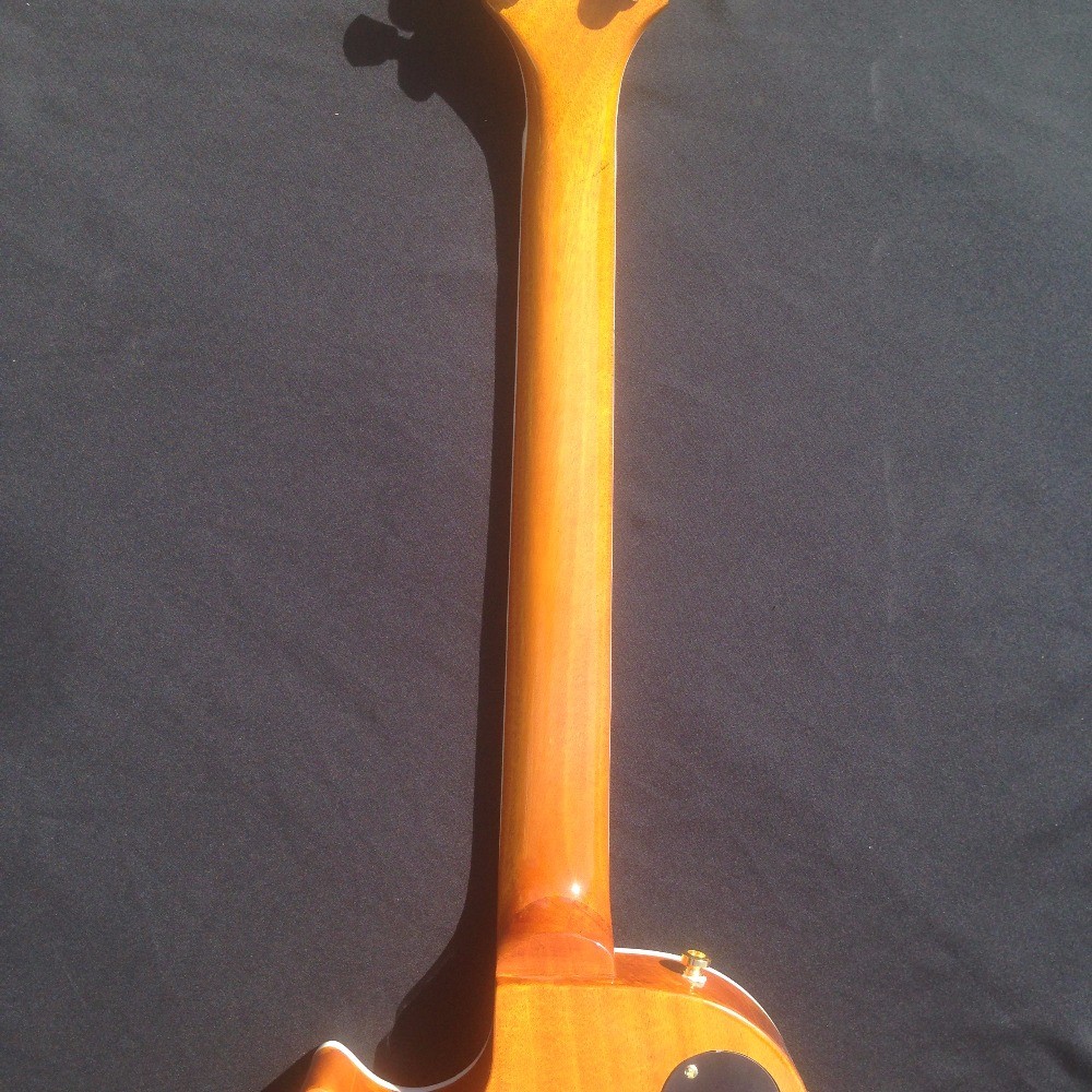 Standard LP electric guitar with gold hardware and flower inlay