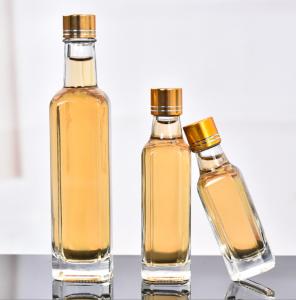 Quality Glass Olive Oil Bottle 100ml 250ml 500ml Round Clear Cooking Oil Bottle with Cap wholesale