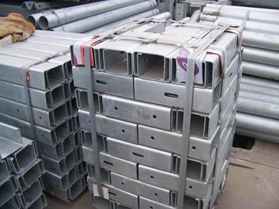 Stacks of U-section offset blocks are packaged with steel strips.