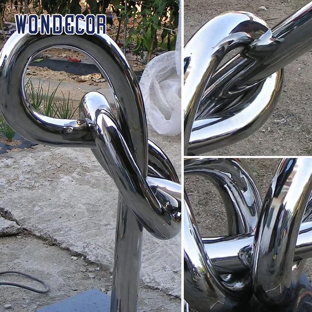 Large geometric circular tube rope stainless steel sculpture