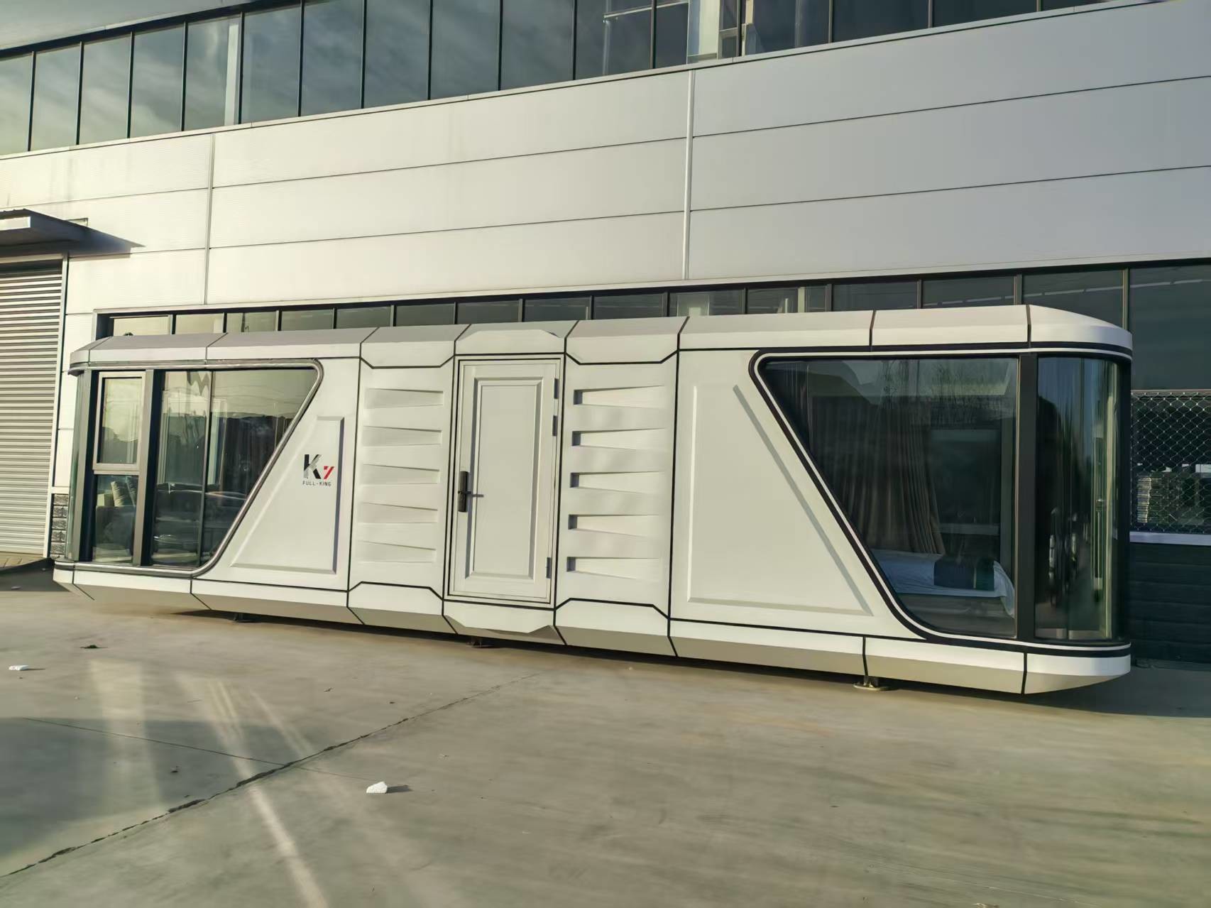 Luxury Modern Prefabricated Capsule House With Balcony Galvanized Steel Frame 11.5*3.4*3.4m