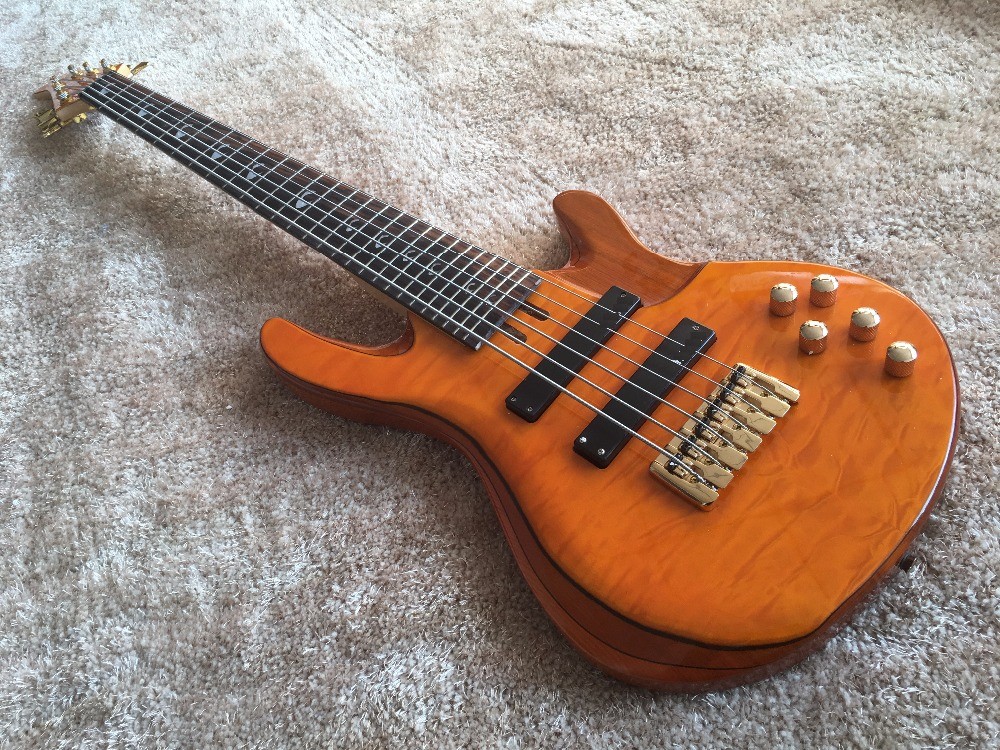 6 string bass guitar JP2 yellow quilted maple body back and front Active pickups Golden bridges and tuner Alder with ebo