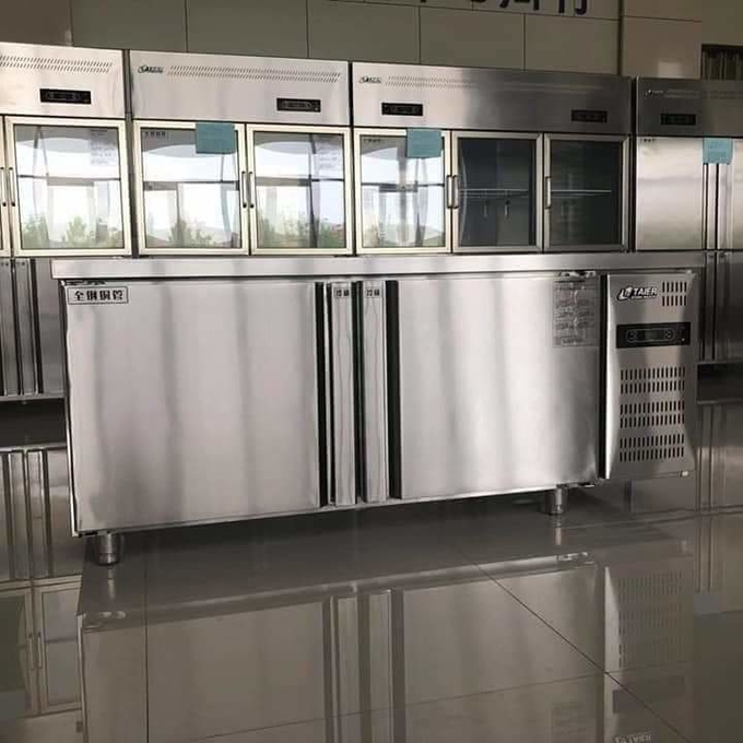 Stainless steel commercial refrigerator workbench in the back kitchen of hotel restaurant 0