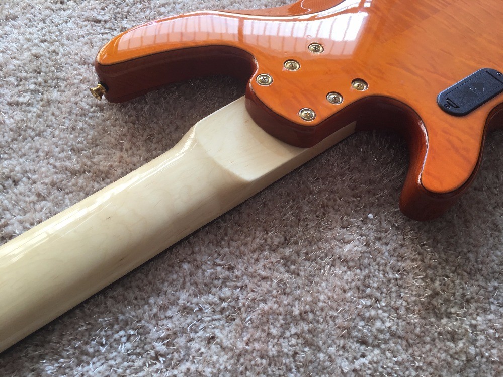 6 string bass guitar JP2 yellow quilted maple body back and front Active pickups Golden bridges and tuner Alder with ebo