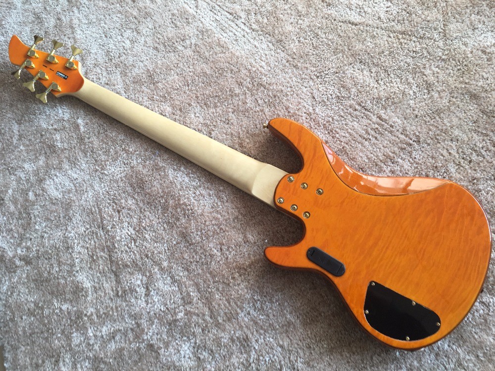 6 string bass guitar JP2 yellow quilted maple body back and front Active pickups Golden bridges and tuner Alder with ebo