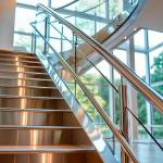 Durable Stainless Steel Handrails with Wood Accents for Glass Railing Systems