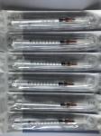 Disposable syringe with slip
