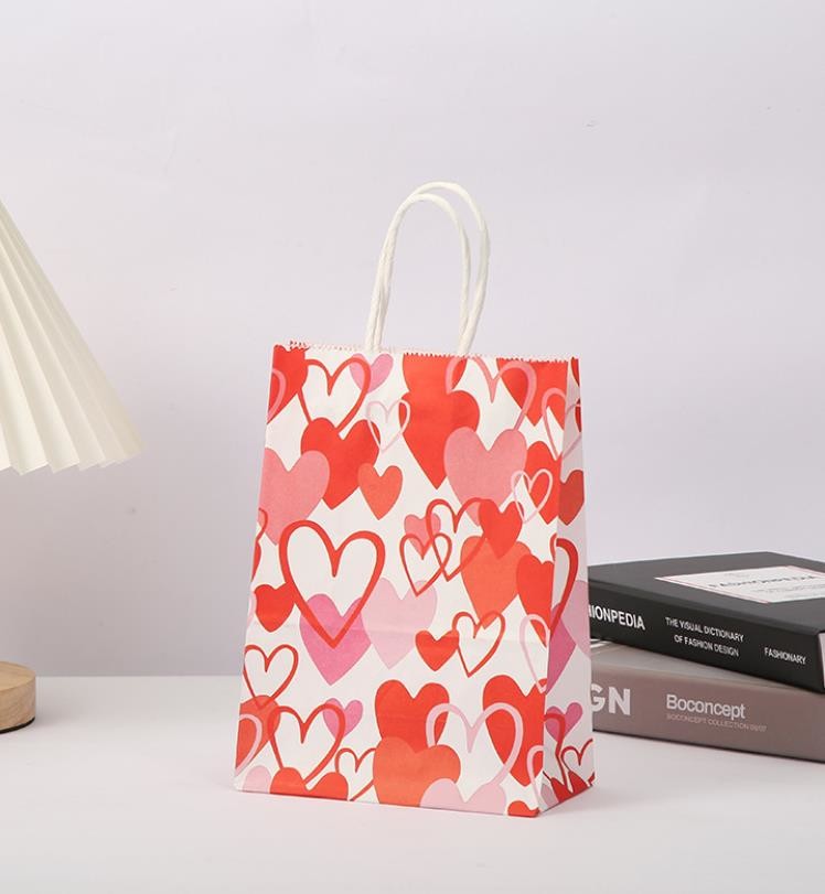 Red 80gsm Kraft Paper Gift Bags Love Heart Printed Paper Goodie Bags With Handles