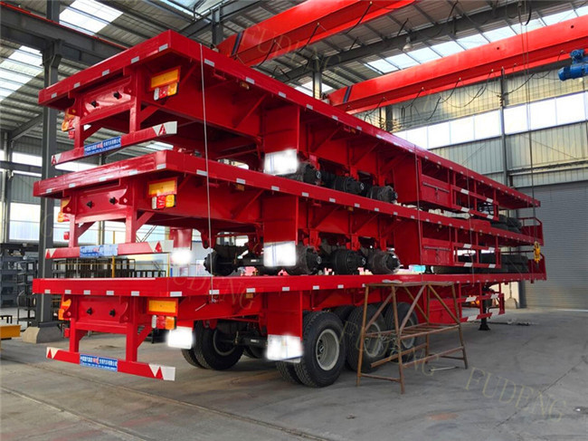 Three Axles Flatbed Equipment Trailers 28 Tons Support Leg 40 Tons Load Capacity