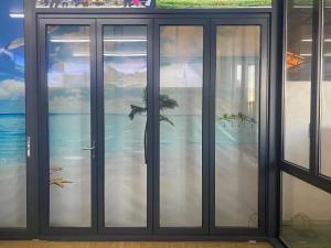 Quality Safety Tempered Glass Black Aluminium Bifold Doors Typhoon Resistance wholesale