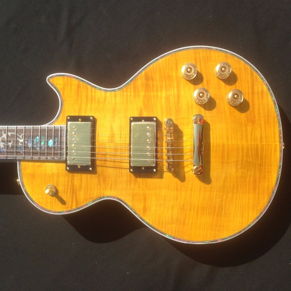 Standard LP electric guitar with gold hardware and flower inlay