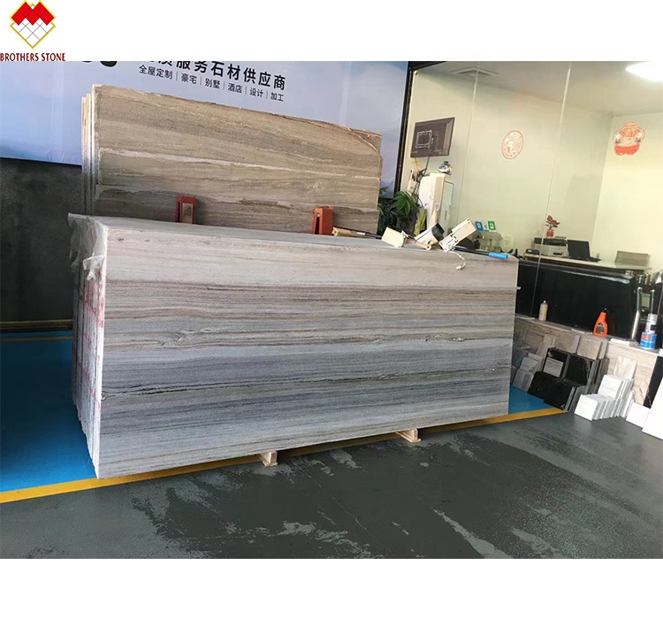 White Wood Look Marble Tiles Stair Follow Veins for a Versatile and Timeless Design