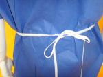 Comfortable Non Woven Surgical Gown Flat Round Neck Style SMS PP Material