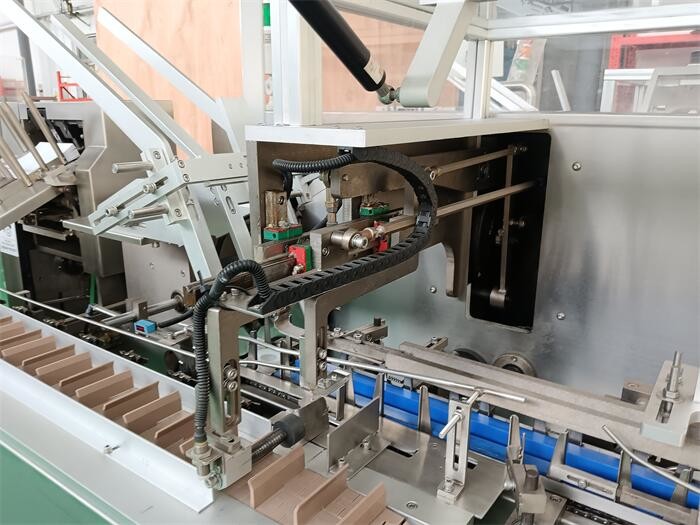 Fully Automated Pharmaceutical Packaging System for GMP Environments with PLC Control