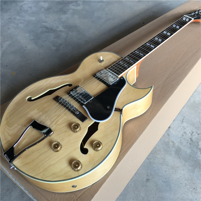 Hollow body jazz guitar with maple body neck