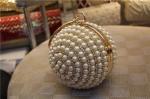 Round high-grade pearls evening bags woman holding a high-end fashion evening