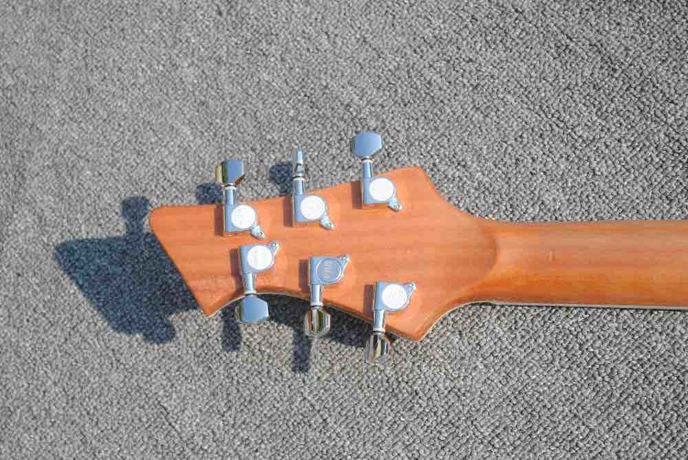 High quality custom 6 string electric guitar, flame maple veneer, wood color body, double F hole half hollow body, rosew