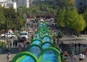 Quality Outdoor Inflatable Slide The City Huge Water Slide 2 Lanes Quadruple Stitching wholesale