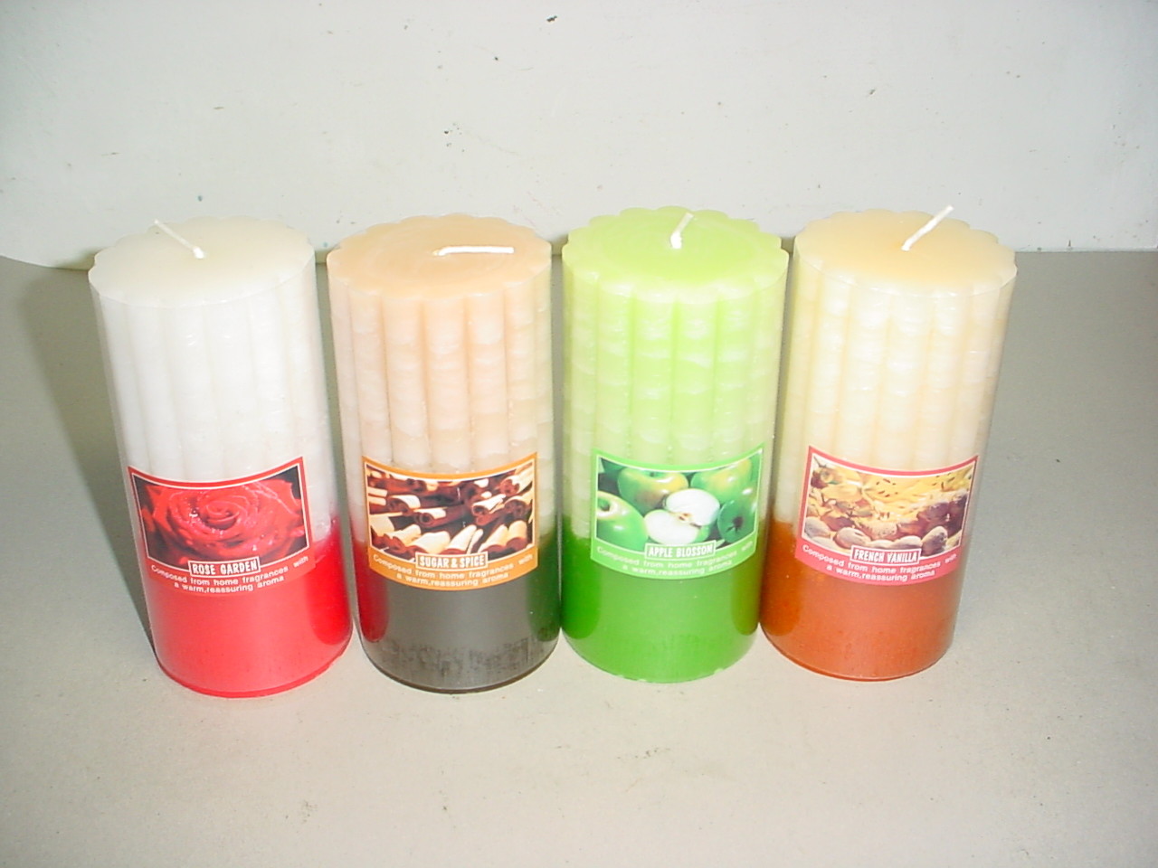 100% paraffin wax scented pillar candle with clear wrapping and printed label