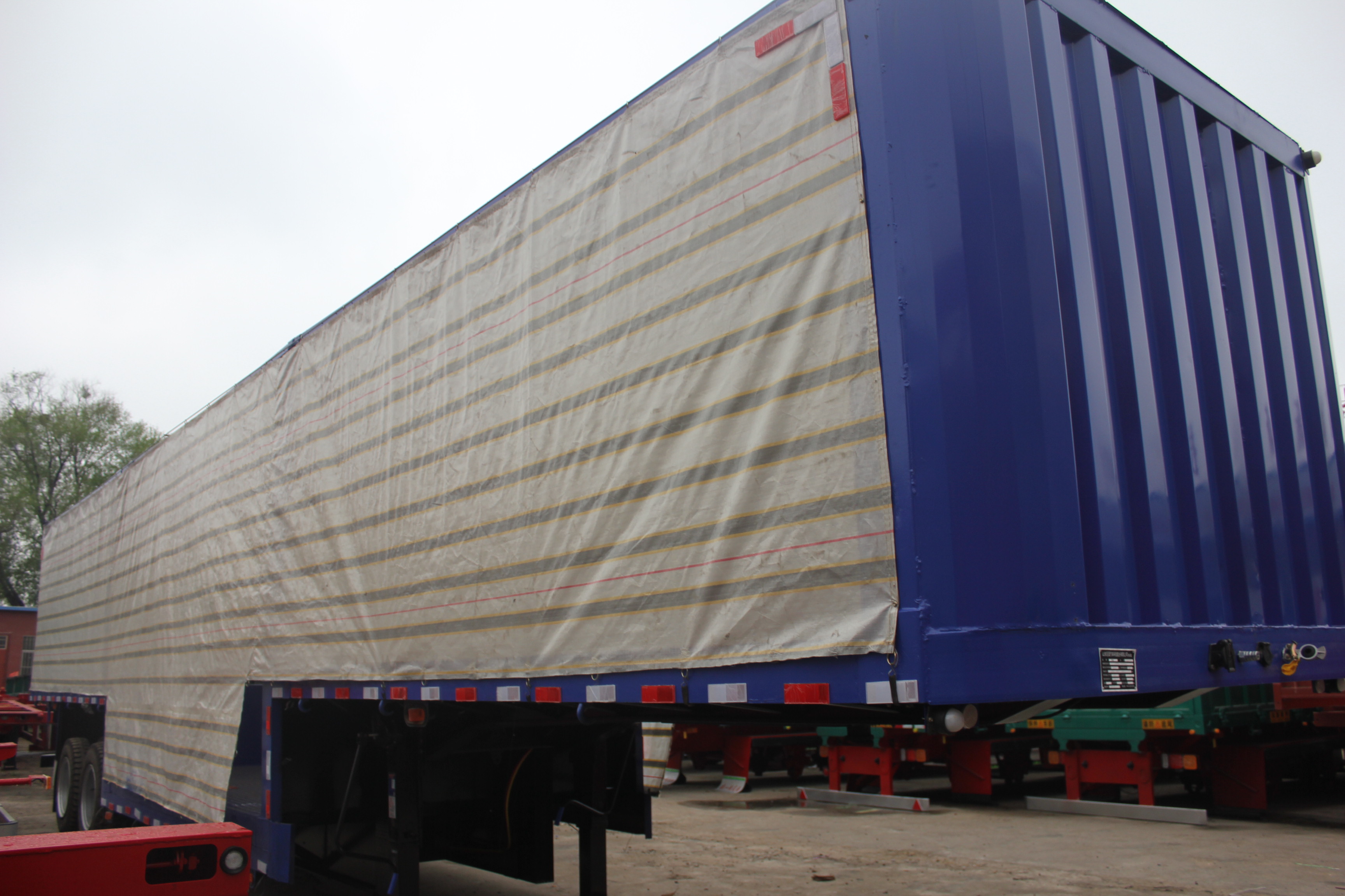 NDRC Announced Enterprise 40 Tons Curtain Semi Trailer with Dual Line Braking System