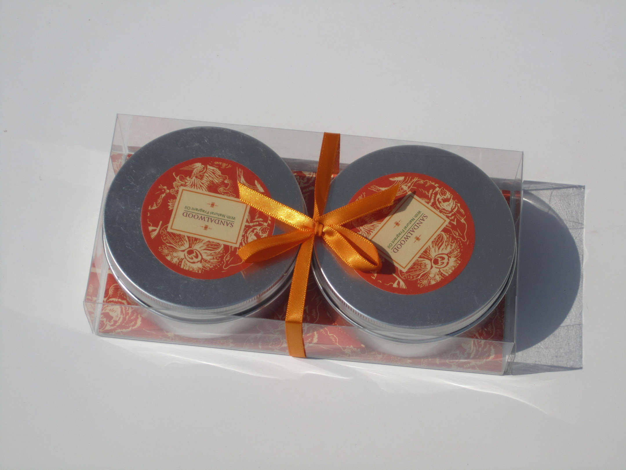 2pk Orange & Brown scented assorted tin candle with printed label,ribbon decor and packed into clear box