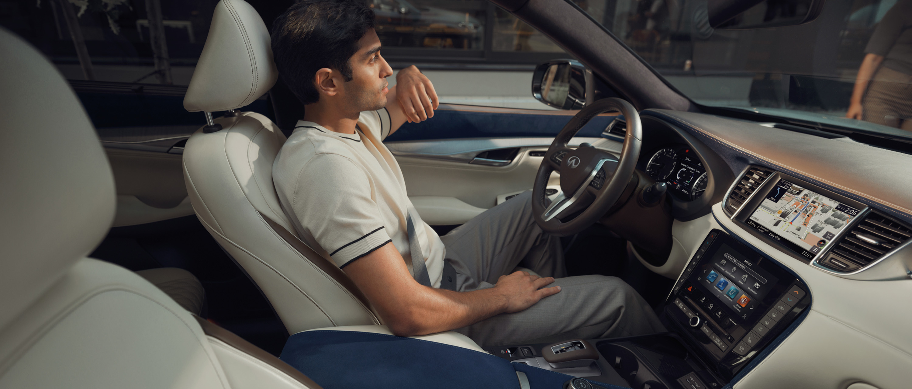 Driver in the 2024 INFINITI QX50 compact SUV