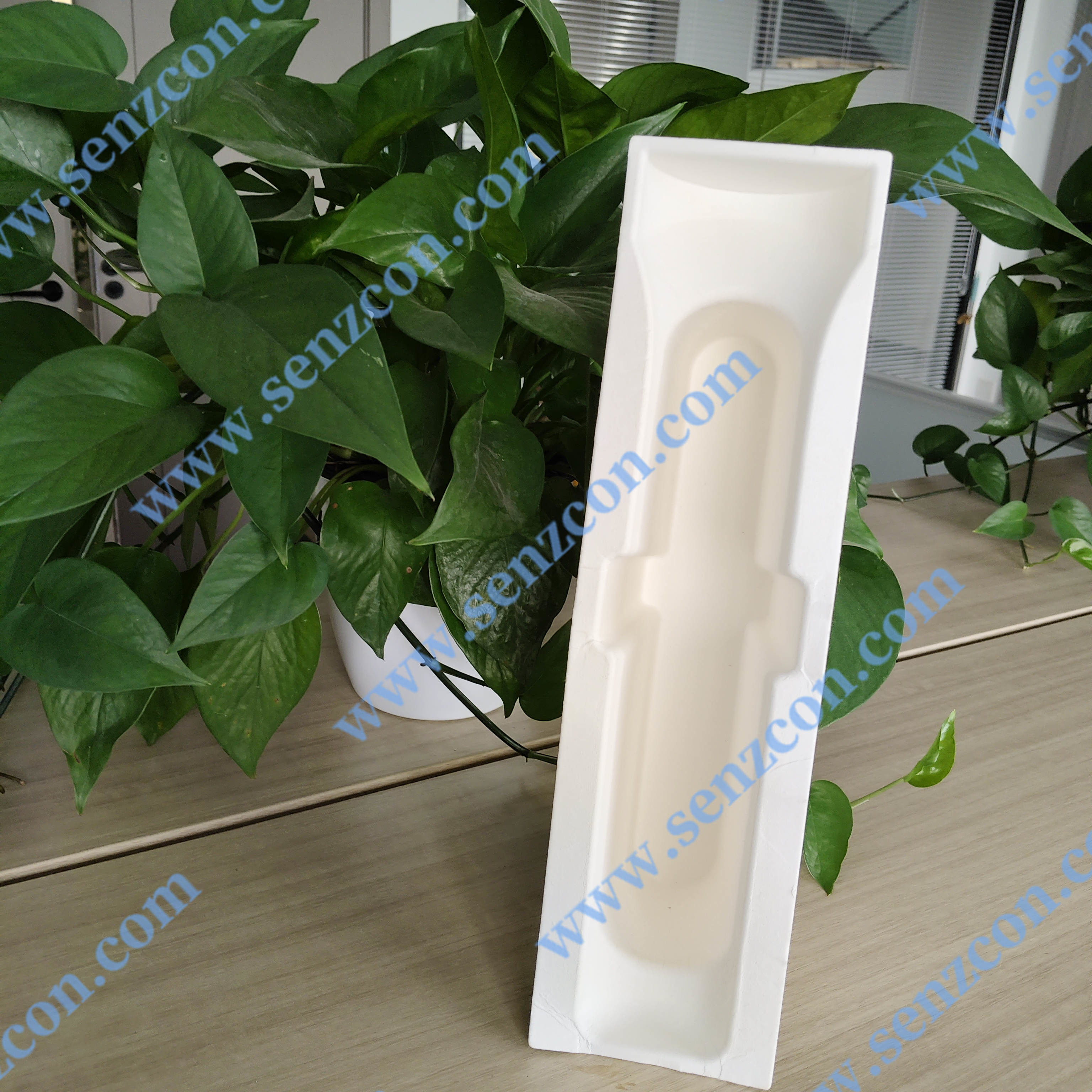 Paper pulp molding packaging for small household appliances. Foldable hair straighteners and hair curling irons. Environmentally friendly white paper