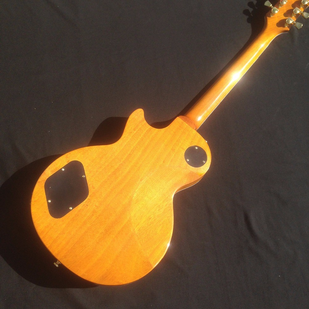 Standard LP electric guitar with gold hardware and flower inlay