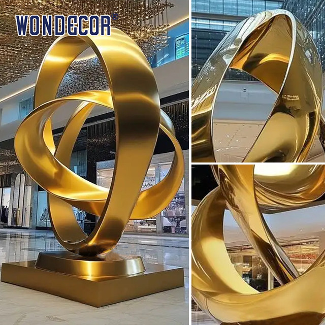 Large indoor hotel lobby Pop Art golden stainless steel statue