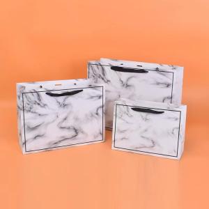Quality 20*28cm 26*35cm 32*43cm Cosmetic Paper Bags With Ribbon Handles wholesale