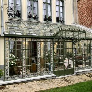 Quality Wrought Iron Four Seasons Sunroom Glass Houses Metal Greenhouse Villa Entrance Doors Living Room Modern Design Customized wholesale