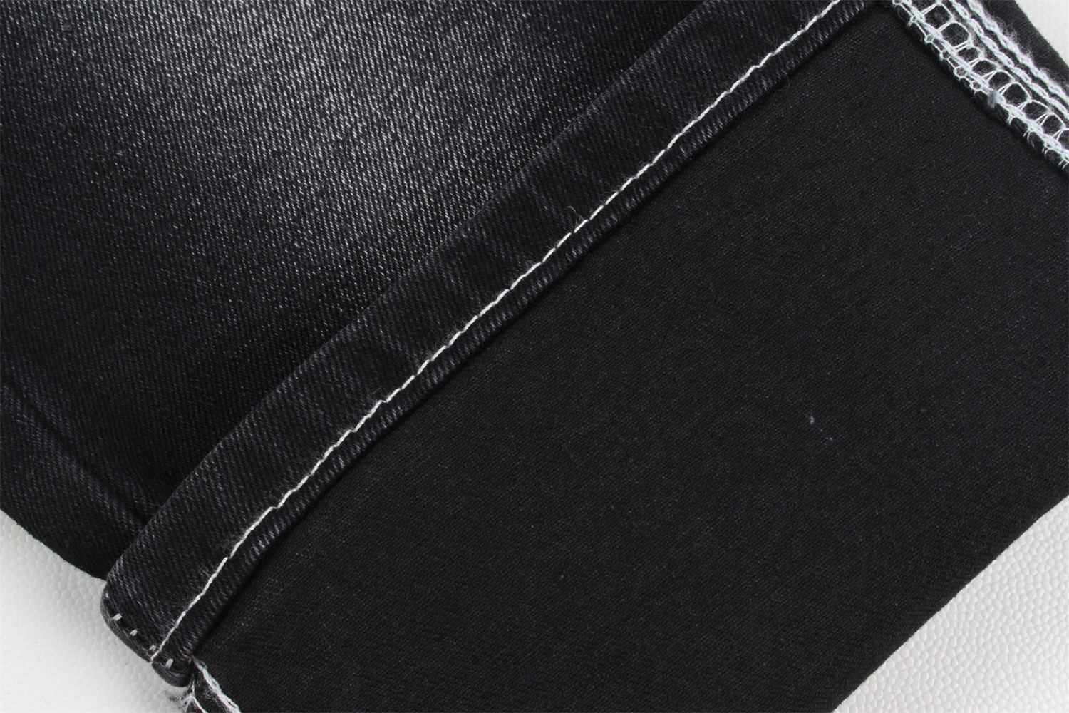 Wholesale 10.5 oz warp slub high stretch black backside woven denim fabric for jeans