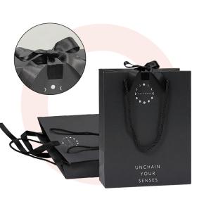 Quality Custom Design Luxury Black Matte Thick Paper Clothing Packaging Gift Shopping Bag With Logo Ribbon And Handle wholesale