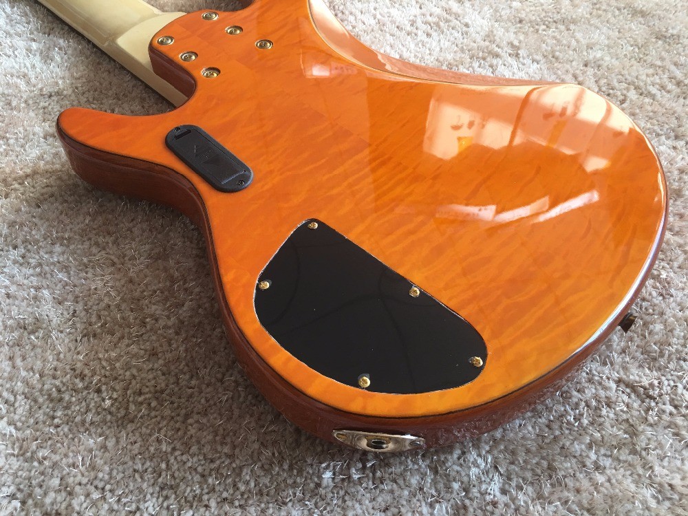 6 string bass guitar JP2 yellow quilted maple body back and front Active pickups Golden bridges and tuner Alder with ebo